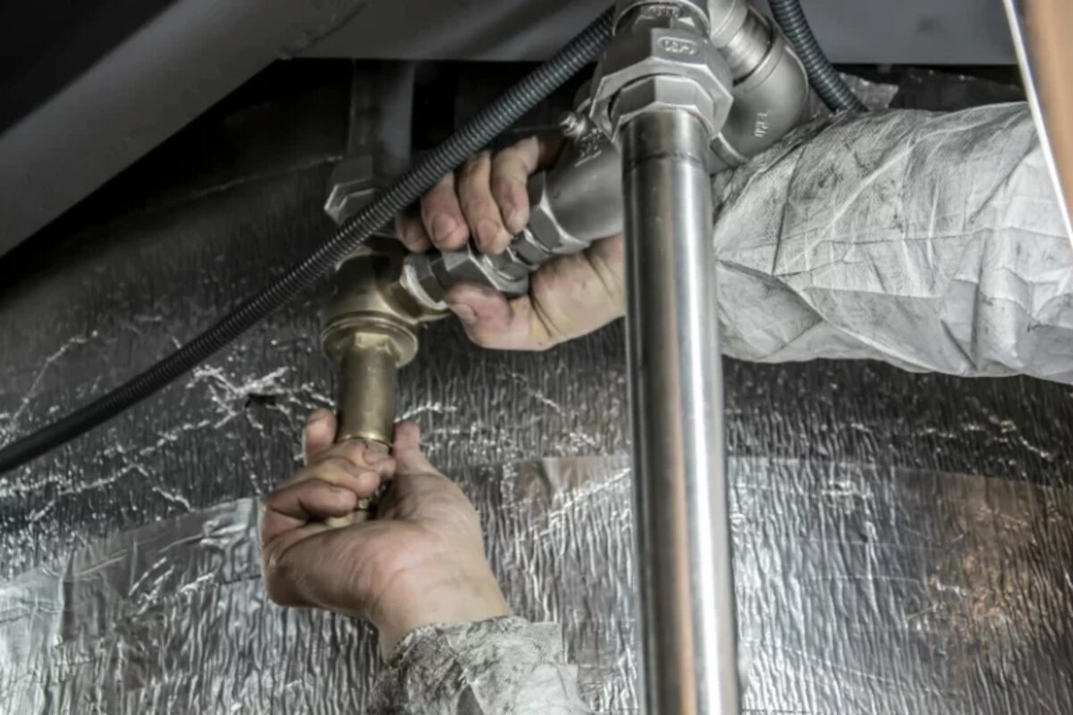 Blackbox Plumbing technician fixing a pipe